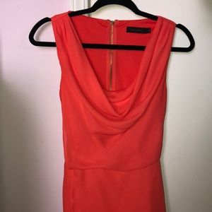 The limited bright orange/coral dress